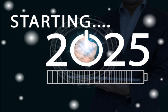 starting 2025 and loading bar icon on virtual screen and a man with tablet in background.