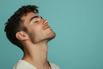Obraz premium A close up of a man's face with his eyes closed
