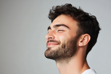 Fototapeta premium A close up of a man's face with his eyes closed