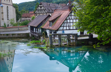 Naklejka premium Historic hammer mill at the Blautopf, Blaubeuren, Germany