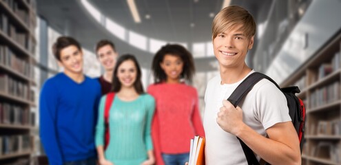 Academic success. Happy young student standing in classroom