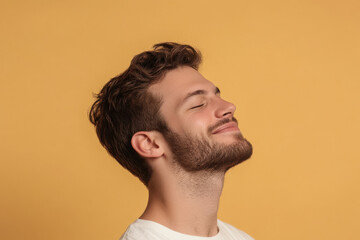 Obraz premium A close up of a man's face with his eyes closed