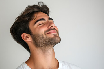 Fototapeta premium A close up of a man's face with his eyes closed