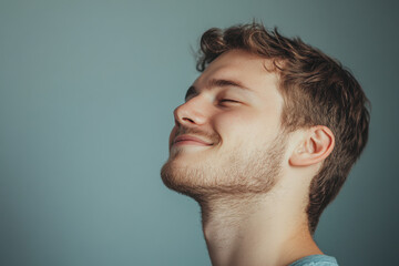 Obraz premium A close up of a man's face with his eyes closed