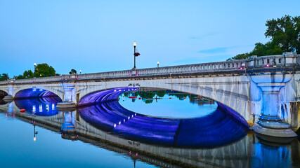 Aerial Fly Through of South Bend's River Lights Plaza Bridge at Blue Hour