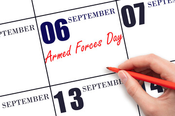 September 6. Hand writing text Armed Forces Day on calendar date. Save the date.