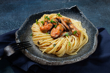 spaghetti with mussels, without shell, pasta with peeled mussels, in carbonara sauce, micro-greens, homemade, no people,