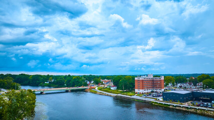 Naklejka premium Aerial View of Mishawaka Riverside Town with Bridge and High-Rise Building