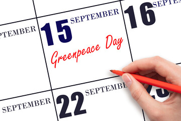 September 15. Hand writing text Greenpeace Day on calendar date. Save the date.