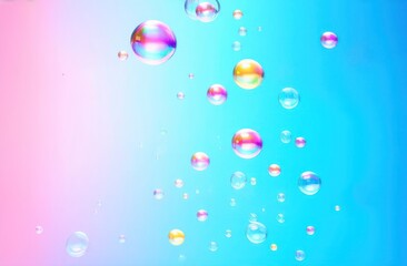 Obraz premium Delicate soap bubbles floating gracefully against a smooth, pastel gradient background that transitions from soft pink to light blue.