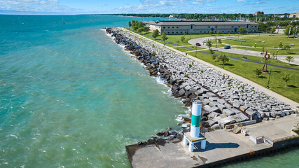 Aerial View of Lighthouse Breakwater and Green Space on Lake Michigan