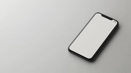 A modern black smartphone with a blank white screen rests on a minimalist grey background, showcasing its sleek design and potential for app display or mobile marketing.
