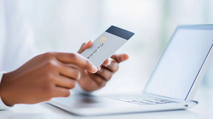 Fototapeta premium A person using a smartphone for online shopping, holding a credit card to make a secure transaction. The close-up shot highlights the convenience and security of mobile payments, m