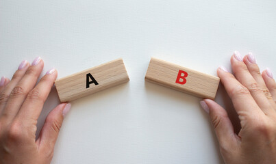 Plan A and Plan B symbol. Concept word Plan A and Plan B on wooden blocks. Businessman hand....