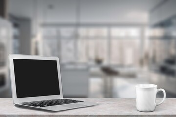 Open laptop with empty blank screen at home office