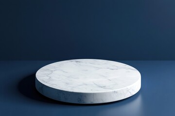 Round white marble table surface against a rich blue background, perfect for displaying items