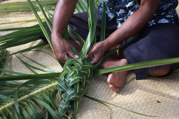 Fijian traditional basket weaving from palm leaves, men's basket demonstration, Fiji