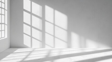 Fototapeta premium A minimalist interior space with shadows cast by windows.