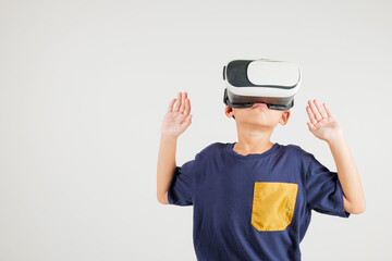 Portrait Asian smiling kid boy touching at something in a virtual reality glasses headset studio shot isolated white background, Excited happy primary child using VR play simulation game