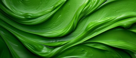  A tight shot of a green backdrop, featuring a wave of paint at the bottom The wave is situated in the middle of the image's base