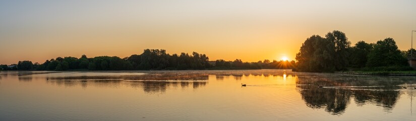 Foggy lake sunrise. Milton Keynes. Caldecotte Lake. England