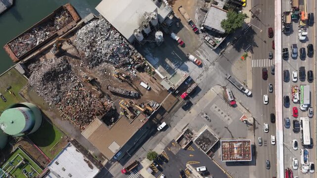 static overhead shot of traffic passing metal scrapyard in Gowanus Brooklyn
