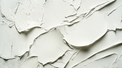 Textured white paint on canvas, showcasing smooth, intricate layers that create depth and dimension.