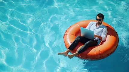 A man of Middle-Eastern descent relaxes on an inflatable ring, working on his laptop in a clear blue pool.