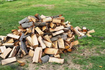 Wood for the fireplace, stack in the garden.