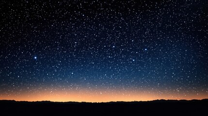 Fototapeta premium A serene night sky filled with stars, transitioning to a warm horizon.
