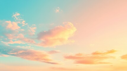 A serene sky at sunset with soft clouds and a gradient of warm colors.