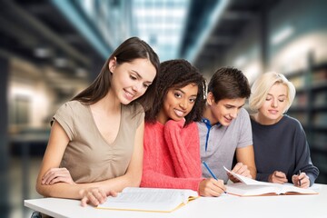 Group of teenage happy students study in classroom library
