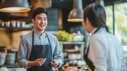 A chef engages with a potential investor discussing partnership opportunities in a contemporary dining space
