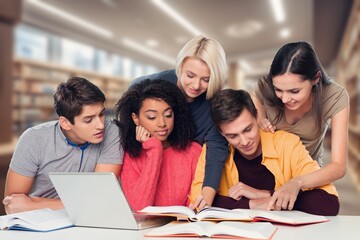 Fototapeta na wymiar Group of teenage happy students study in classroom library