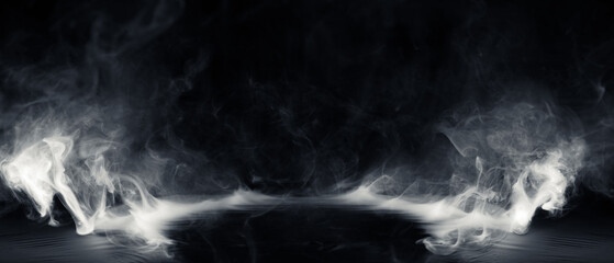 Real smoke exploding outwards with center space. Dramatic smoke or fog effect for spooky Halloween background or wallpaper.