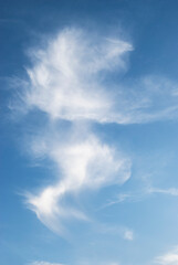 gentle white clouds in the blue sky