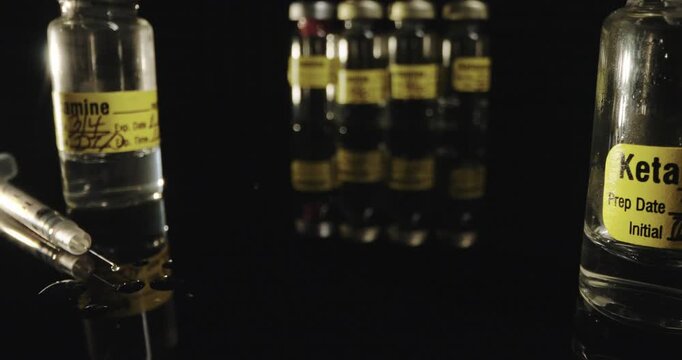 Ketamine Vials and Dripping Syringe