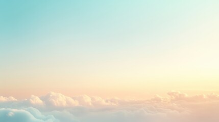 Obraz premium A serene sky with soft clouds and a gradient of pastel colors at sunrise or sunset.