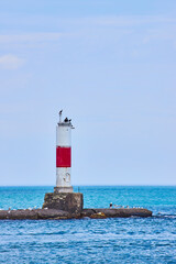 Red and White Lighthouse with Birds on Lake Michigan at Eye Level