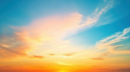 Fototapeta premium A serene sunset sky with vibrant colors blending into clouds.