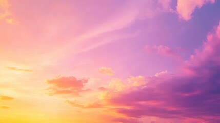 Obraz premium A serene sunset sky with vibrant hues of pink, purple, and orange blending together.