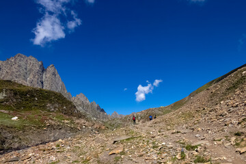 Beautiful mountain scenery. River, valley, snow, blue sky, white clouds. In-depth trip on the Sonamarg Hill Trek in Jammu and Kashmir, India