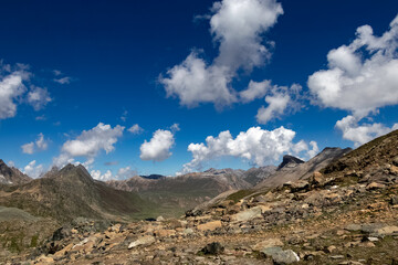 Beautiful mountain scenery. River, valley, snow, blue sky, white clouds. In-depth trip on the Sonamarg Hill Trek in Jammu and Kashmir, India