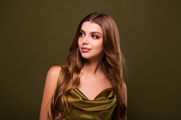 Naklejka premium Photo of elegant dreamy pretty cute lady in silky dress isolated on khaki color background