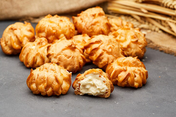 Delicious cream-filled profiteroles, golden and crisp, perfect for a sweet dessert treat