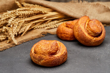 Freshly baked cinnamon roll with a golden crust and a sprinkle of sugar, perfect for a sweet treat
