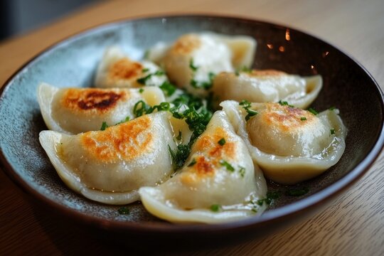 Pierogi, Dumplings filled with a variety of ingredients such as potatoes, cheese, meat, or fruit, typically boiled and then sometimes fried.