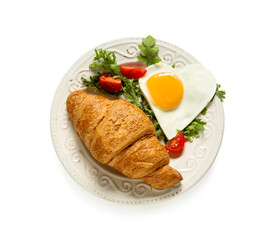 Plate with tasty fried egg, croissant, tomatoes and arugula on white background