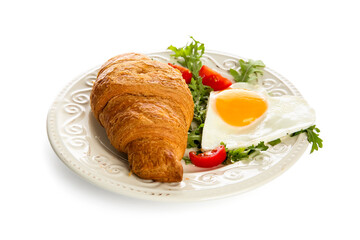 Plate with tasty fried egg, croissant, tomatoes and arugula on white background