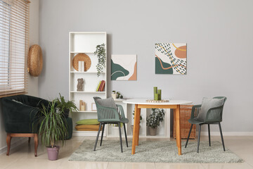 Modern living room with black sofa, table and shelving unit